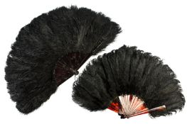 Two black ostrich feather fans early 20th century, with tortoiseshell sticks, length 39cm
