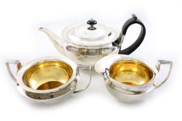A George V silver three piece tea set by James Dixon & Sons, hallmarked Sheffield 1928, of squat