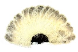 A cream and grey ostrich feather fan, early 20th century, with tortoiseshell sticks, length 49cm