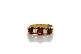 A Victorian five stone ring set with three rubies and two diamonds, in raised heart shaped