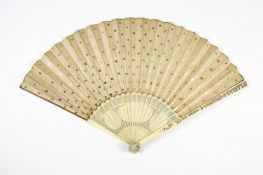 A Chinese carved ivory and paper fan, late 19th century, the guard sticks with carved scenes of