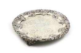 A George IV armorial silver salver, hallmarked London 1821, with ornately embossed foliate rim,