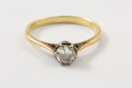 An 18ct gold single stone diamond ring in claw setting Ring size N