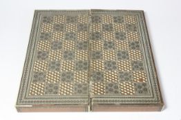 An Anglo Indian games compendium late 19th century, of typical decoration, the top inlaid with