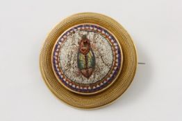 A 19th century Italian micro mosaic circular brooch the centre set with micro mosaic panel of a