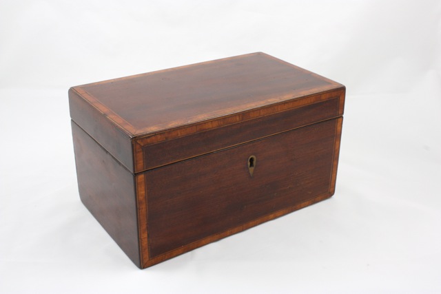 A late George III mahogany and satinwood cross banded tea caddy circa 1880, of rectangular form, the