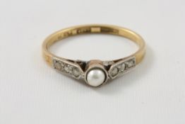A gold and platinum single set pearl ring with six rose diamonds to shoulders, the pearl in a collet