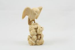 A late 19th century Japanese carved ivory Okimono realistically carved as an eagle perched on