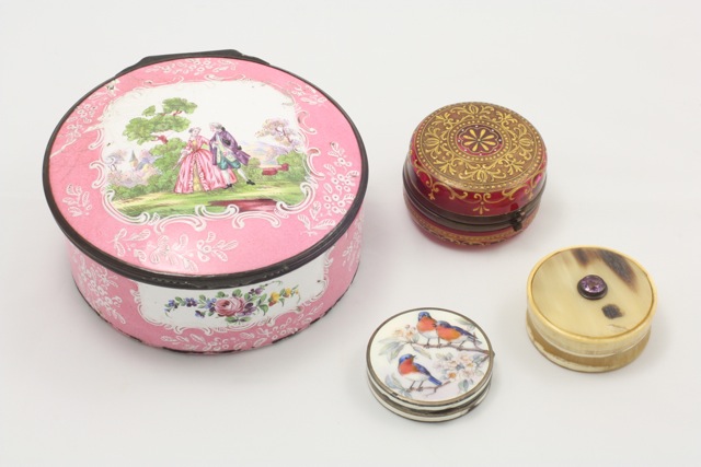 A group of four ladies trinket and pill boxes comprising a silver and enamelled circular box