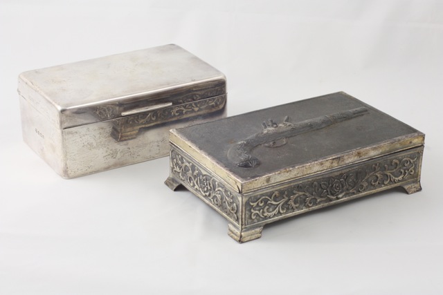 A silver cigarette box hallmarked Birmingham, 1925, of rectangular form with no inscriptions, wood