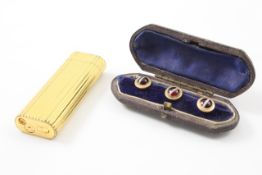 A set of gentleman`s dress studs early 20th century, set with tigers eye, in a fitted leather case