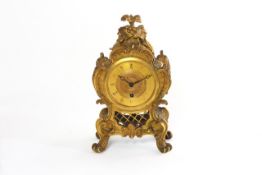 An ormolu Rococo mantel timepiece French, circa 1830, French movement with painted gilt dial,