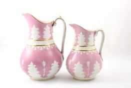 Two pink late 19th century water jugs decorated with Greek key motif and acanthus leaves on