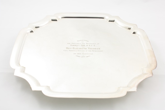 A presentation silver plated salver circa 1940, with inscription reading Presented by The Officers