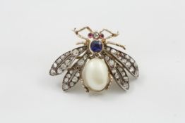 A Victorian novelty brooch modelled as a bee circa 1880, set with cabochon ruby eyes, old-cut