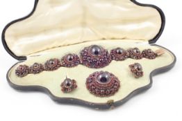 A Victorian demi-parure of Bohemian garnets mid 19th century, comprising bracelet with seven small