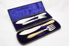 A cased pair of fish servers Birmingham 1879/80, with spiral twist ivory handles, the silver