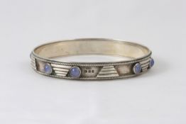 An Arts and Crafts silver stiff bangle by Henry George Murphy hallmarked London 1929/30, with