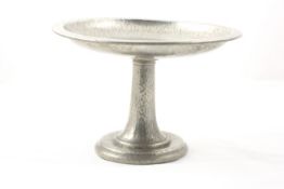 A Tudric pewter comport early 20th century, the simple stand with hammered design stamped on the