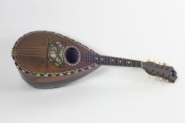 A late 19th century mandolin with inlaid mother of pearl, tortoiseshell and ivory forming a