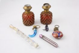 A group of seven 19th century scent bottles mainly Continental, including a pair of red glass and