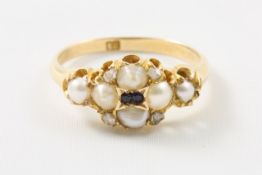 A Victorian 18ct gold cluster ring set with split pearls and two small sapphires to centre Ring size