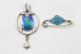 A Charles Horner silver Art Nouveau stylised oval pendant English, circa 1905, with green and blue