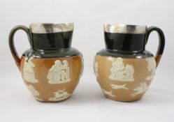 A pair of Doulton silver mounted stoneware harvest jugs hallmarked London 1905, of typical Doulton