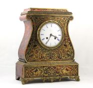 A red Boulle mantel clock French, circa 1850, of lyre form, bell striking movement with silk