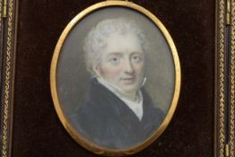 An oval miniature on ivory of James Needham (1766-1837) early 19th century, in a tooled leather