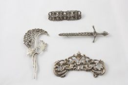 Three silver brooches 19th century, comprising a silver cherub brooch hallmarked London, 1889, a