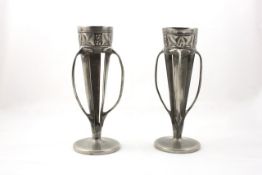 A pair of pewter three handled spill vases Archibald Knox for Liberty & Co circa 1905, with raised