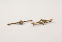 A 9ct gold and platinum set Edwardian bar brooch set with faceted citrine and rose diamonds to side,