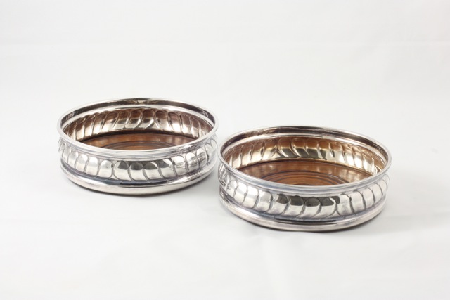 A pair of silver wine coasters hallmarked London 1965/66, diameter 13cm In good overall condition