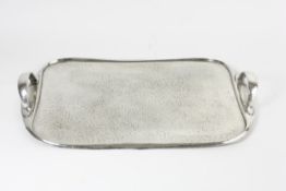 A pewter tray English, early 20th century, with two handles and spot hammered design, numbered on