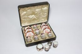 A cased set of Royal Crown Derby six demitasse coffee cups and saucers circa 1900, each decorated in