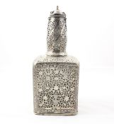 A white metal pierced bottle cover possibly Indian, the glass bottle covered with a pierced metal