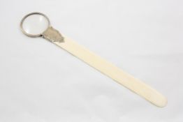 A silver mounted ivory page turner with magnifier hallmarked Birmingham, 1907, makers initials C &