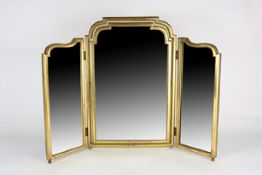 An 18th century style giltwood triptych mirror with simple beaded carved frame, central mirror and