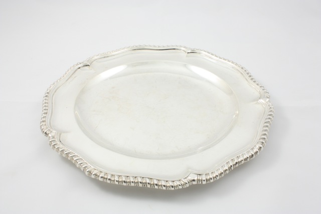 A single silver plate London 1900/01, of Tudor rose form, with a gadrooned border, diameter 24cm