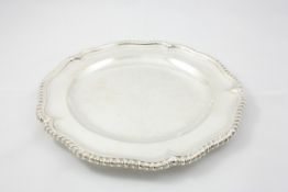 A single silver plate London 1900/01, of Tudor rose form, with a gadrooned border, diameter 24cm