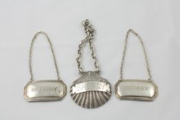 Three silver liquor labels comprising a SHERRY label in the form of a shell on a link chain