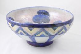 A large Moorcroft lustre glazed `Dawn Landscape` bowl circa 1928, the interior with trees in blue