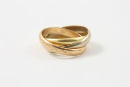 A Cartier three coloured gold Russian wedding ring In good condition. Size N. Approx 10g