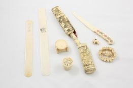 A small group of carved ivory pieces mainly 19th century, including a brooch carved with doves