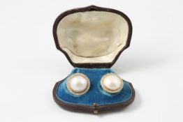A pair of circular blister pearl earrings Continental, late 19th century, surrounded by numerous
