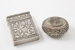 An Indian white metal card case probably late 19th, early 20th century, heavily embossed with