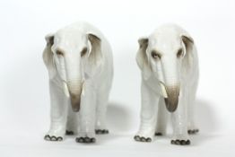 A pair of porcelain elephants probably German, circa 1900, realistically modelled, impressed on