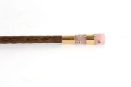 A late Victorian gold mounted and rose quartz handled parasol the handle applied with various