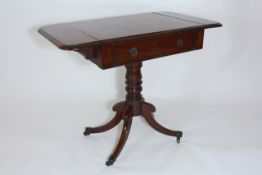 An early Victorian small mahogany sofa table of rounded rectangular form, with single central